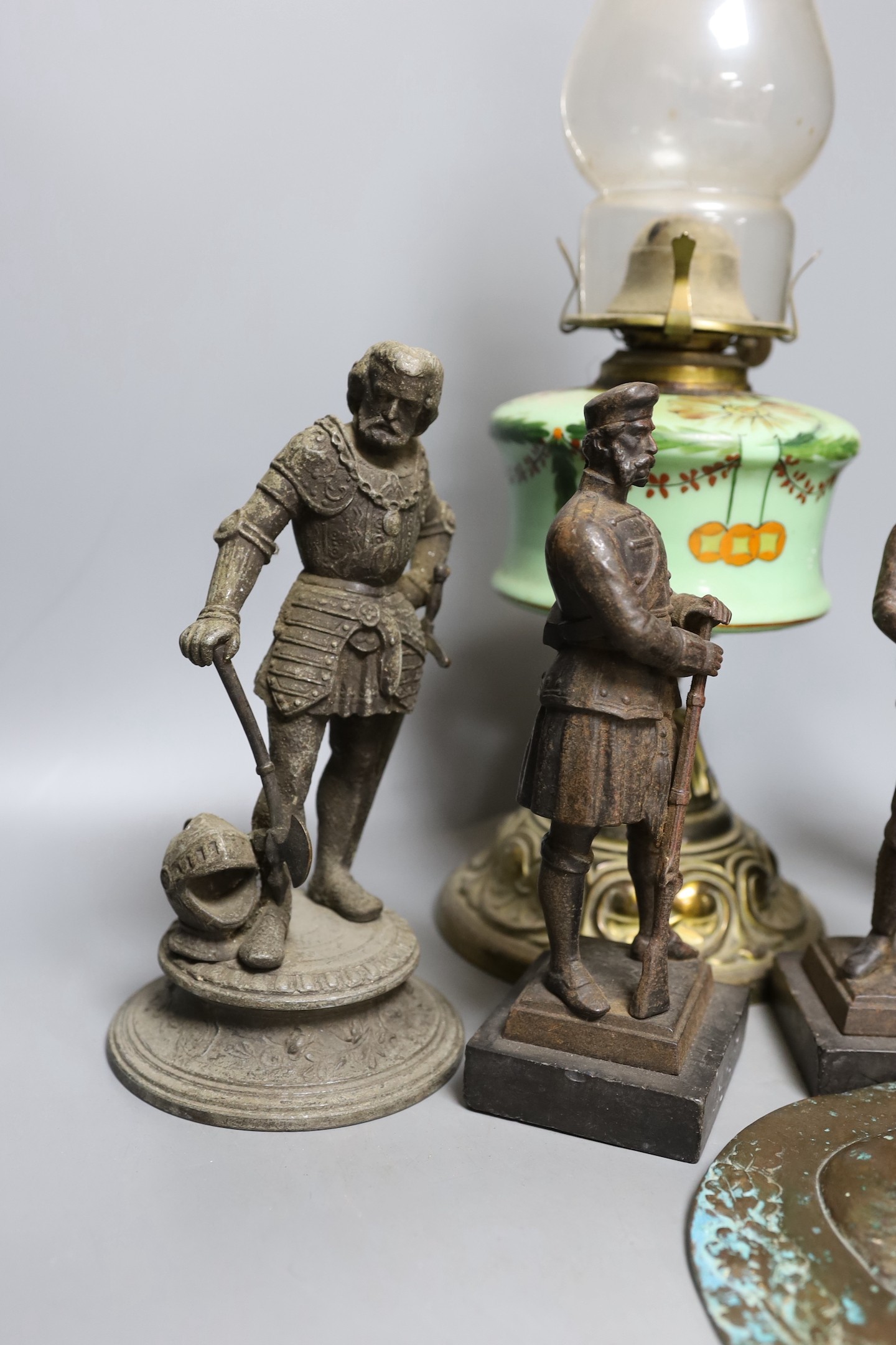 Two pairs of spelter figures, an relief cast portrait plaque, and oil lamp